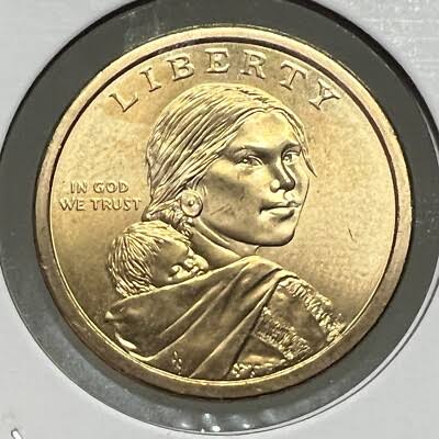 2009 Sacagawea dollar Satin Finish mint set specimen showing distinct matte surface texture compared to regular business strike
